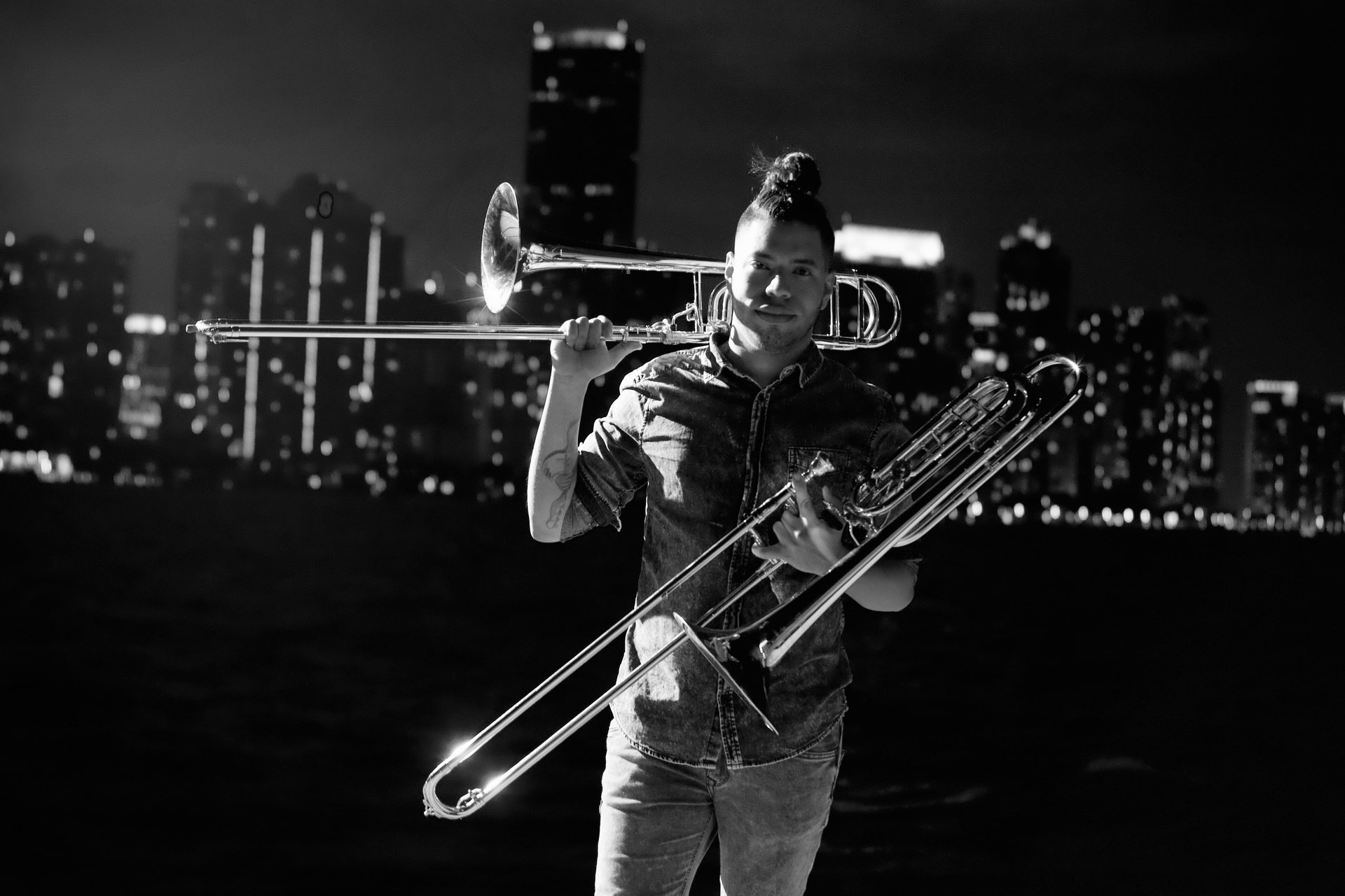 Jhosír Córdova with trombone, Miami skyline